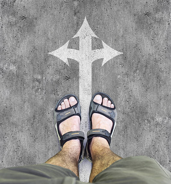 istock Black sandals on the road 490968222