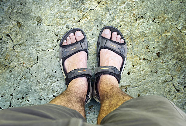 istock Black sandals on the road 490968676