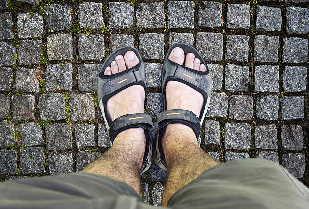 istock Black sandals on the road 490968726