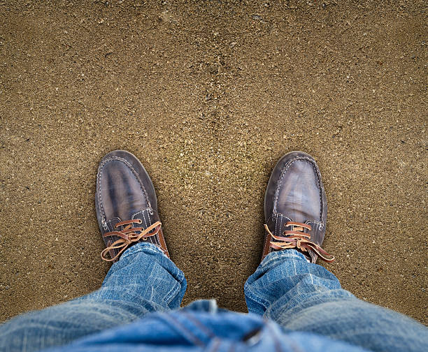 istock Yellow boots on the road 490969750