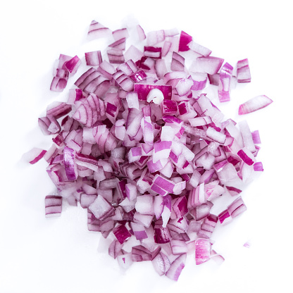 Portion of diced Red Onion (detailed close-up shot) isolated on white background