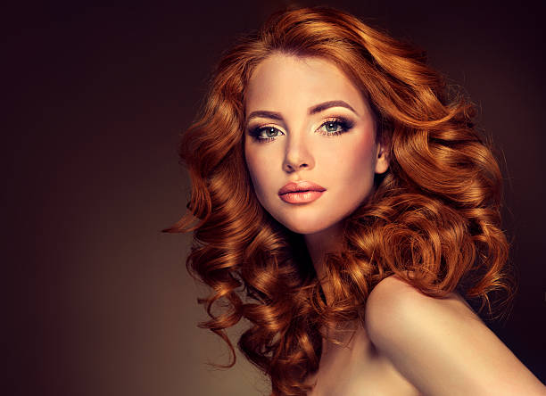 istock Girl model with long curly red hair. 490971084