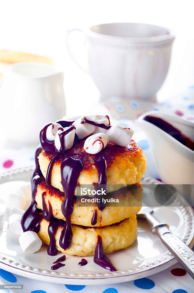 Traditional ukrainian cottage cheese cakes Traditional ukrainian cottage cheese cakes with chocolate sauce 2015 Stock Photo