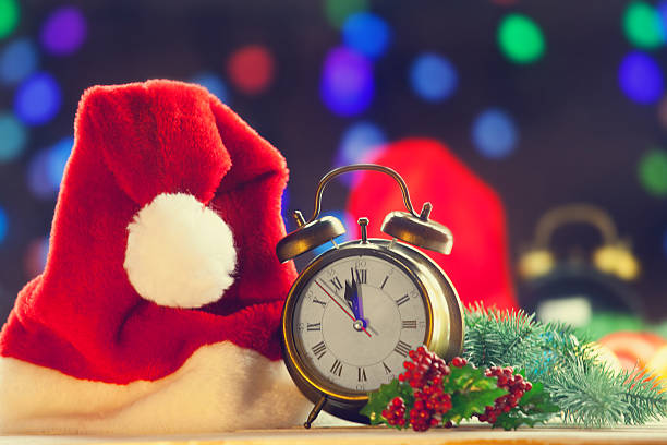 istock Alarm clock and Santa Claus hat 490972276