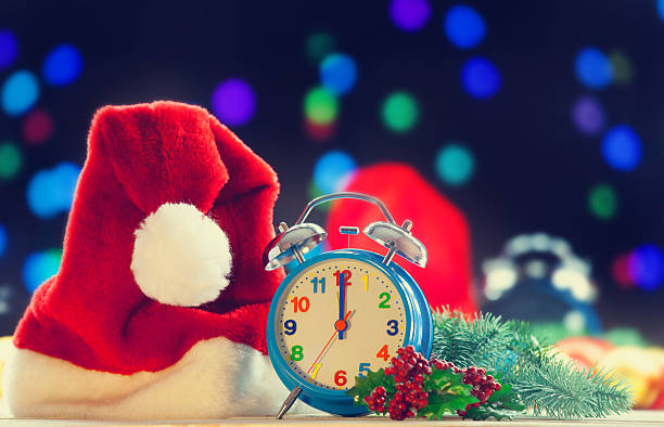 istock Alarm clock and Santa Claus hat 490972298