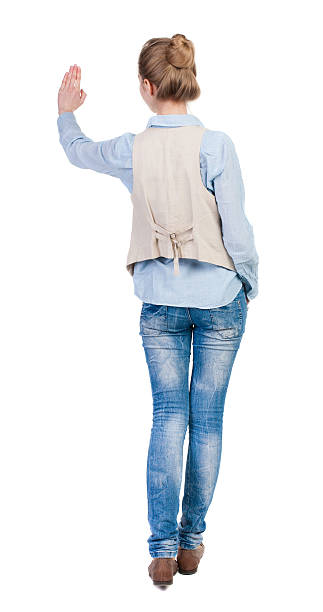 istock Young woman in vest presses down on something. 490972912