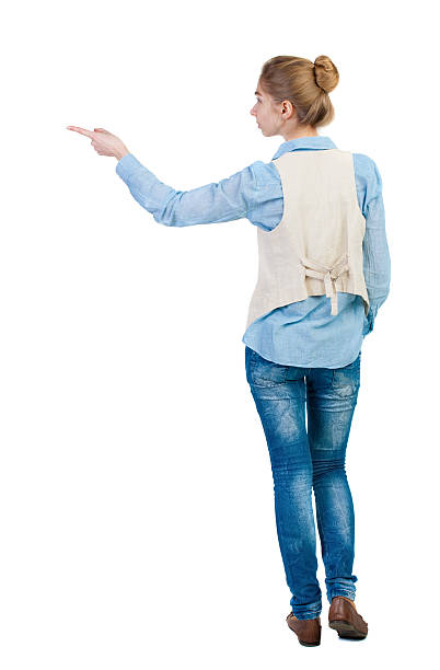 istock Back view of  pointing woman. 490973082