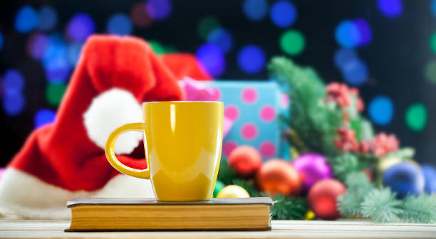 istock Cup of tea or coffee on a book 490984876
