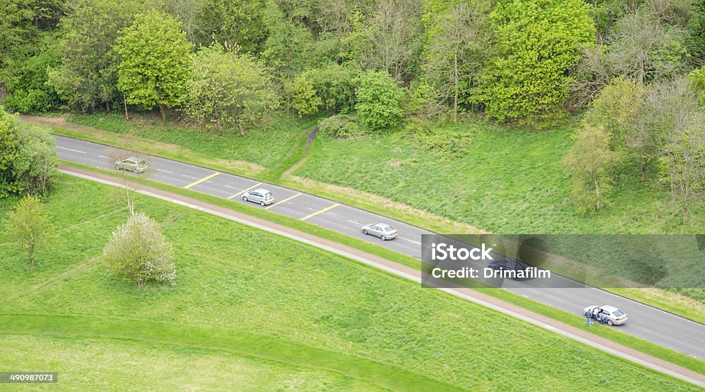 Aerial view of five cars driving in a countryside road Aerial View Stock Photo