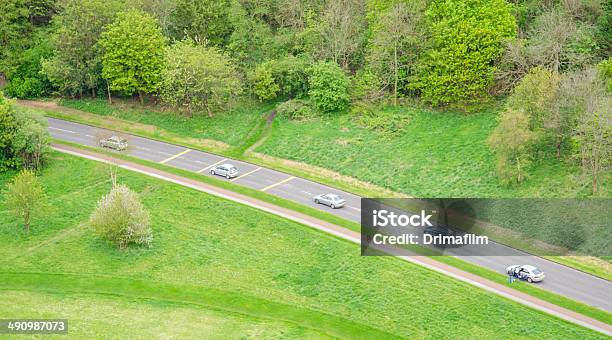 Aerial View Of Five Cars Driving In A Countryside Road Stock Photo - Download Image Now