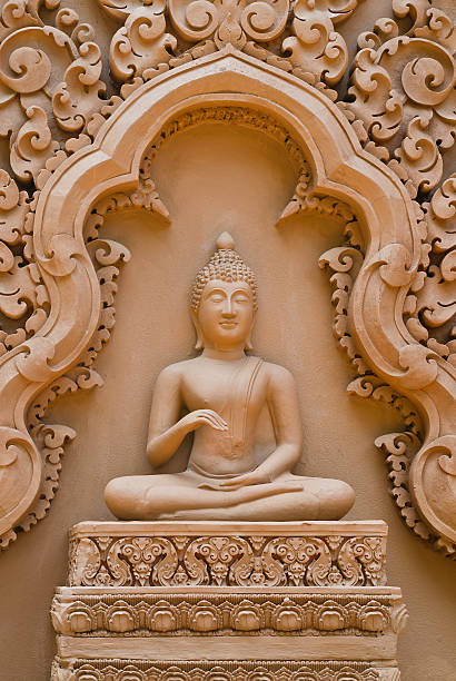istock Buddha sculpture on temple wall, Thailand 490987781