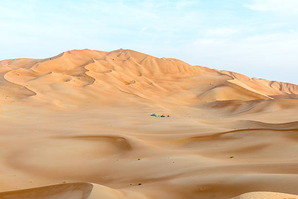 People with tents and cars in Rub al-Khali desert (O stock photo