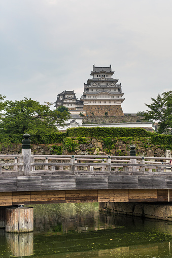 Himeji, Japan - August 12, 2015: Himeji castle taken with the moat and entrance bridge in the foreground