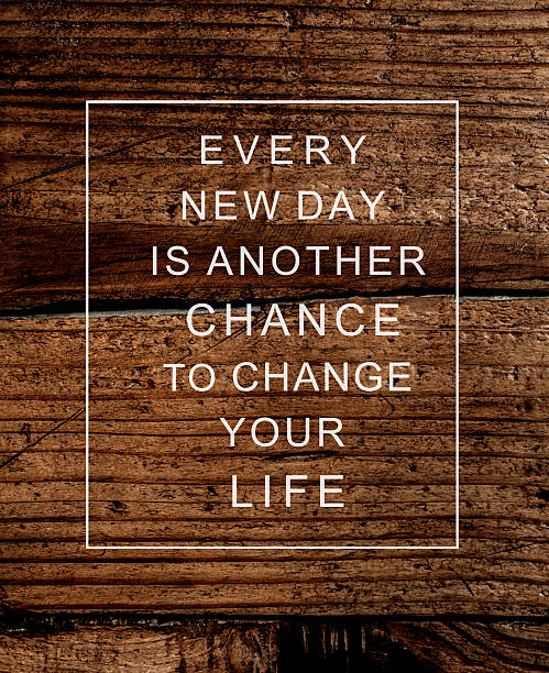 Motivational poster quote on  rustic wooden background EVERY NEW
