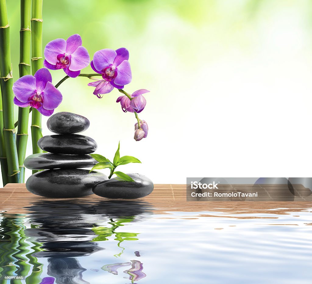 spa background - freshness whit stones, bamboo, orchids and water Alternative Therapy Stock Photo