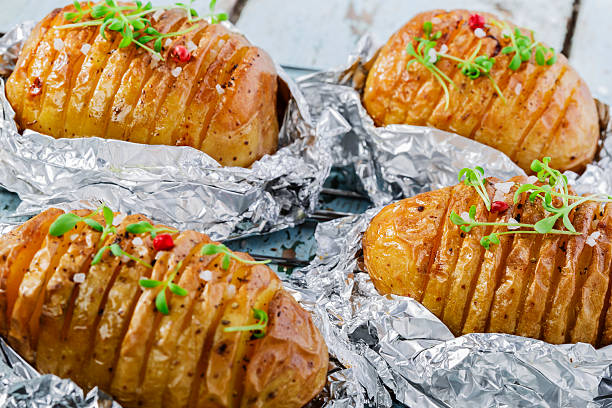 istock whole baked potato in foil 490992199