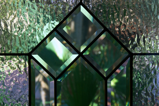 Stained glass window in a chapel illuminated by sunlight