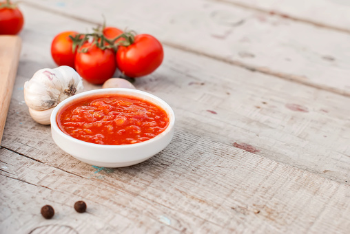 Natural homemade sauce of tomatoes, peppers and vegetables  toned image, selective focus