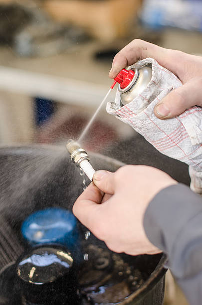 istock Spark plug cleaning in repair shop. 490993749