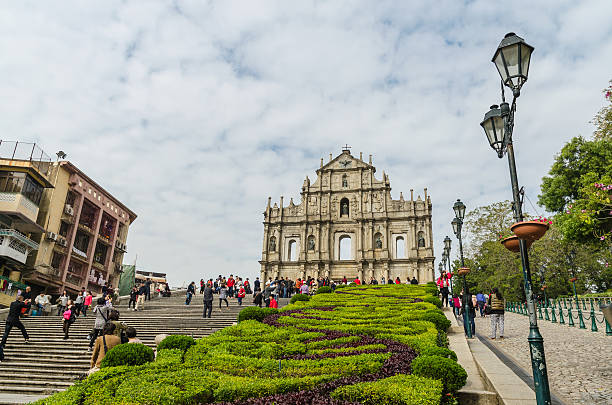 Ruins of st.paul's landmark of macau china Macau, China - Jan 8, 2013: Ruins of st.paul's, One of macau's best known landmark. Some tourists sightseeing and taking pictures with the ruins macao photos stock pictures, royalty-free photos & images