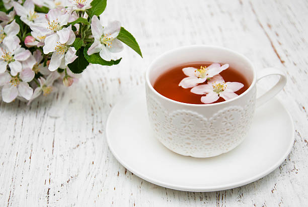 istock Cup of tea and spring blossom 490994646