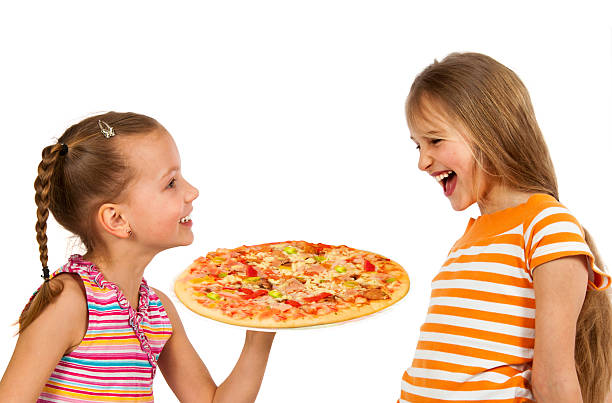 istock Happy kids eating pizza 490996848