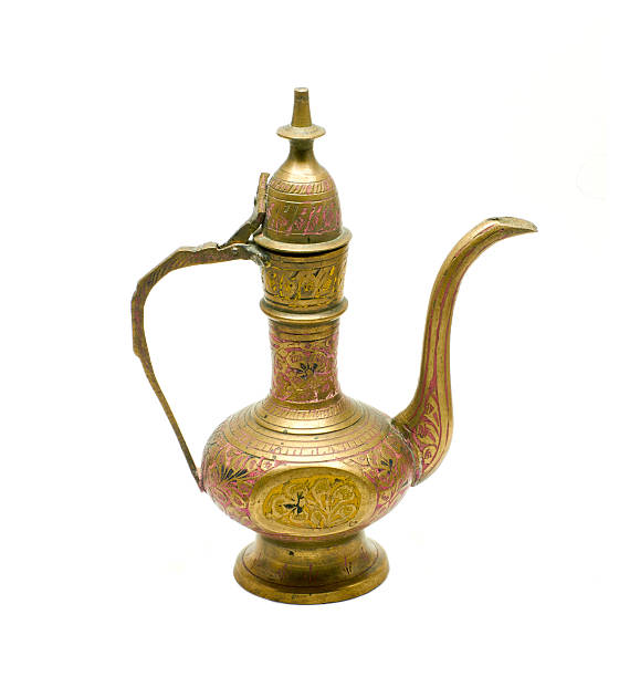 istock Old golden metallic kettle 490998360