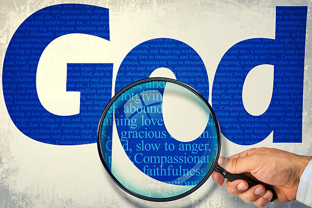 istock The name GOD under observation with magnifying glass 490999232
