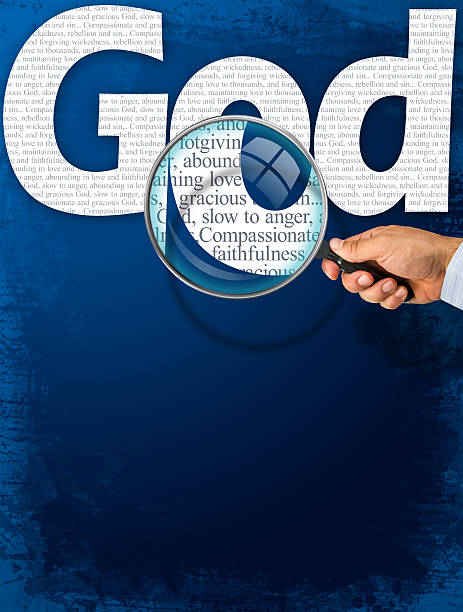 istock The name GOD under observation with magnifying glass 490999610