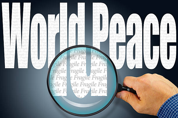 istock The words WORLD PEACE under observation with magnifying glass 491020296