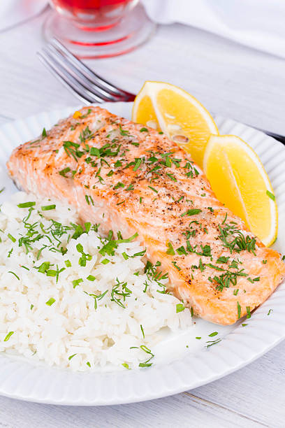istock Steamed salmon with fresh herbs and lemon 491020644