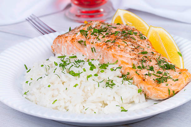istock Steamed salmon with fresh herbs and lemon 491020666