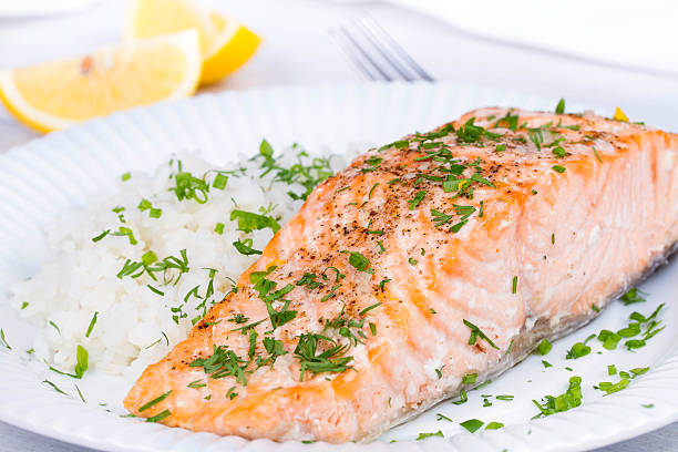 istock Steamed salmon with fresh herbs and lemon 491020806