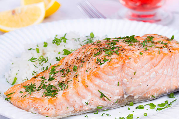 istock Steamed salmon with fresh herbs and lemon 491020882