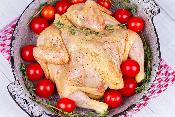 Whole fresh raw chicken prepared for roast