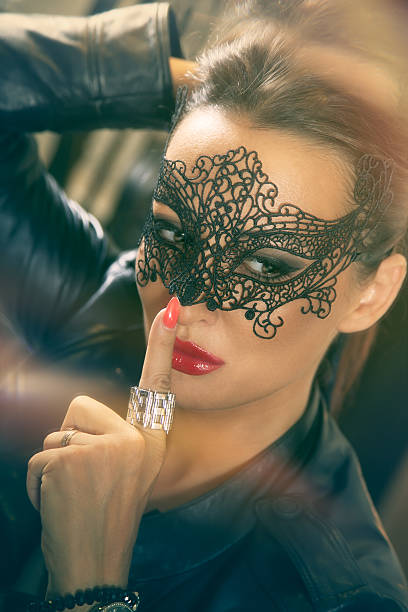 istock Attractive women with black lace mask. 491025522