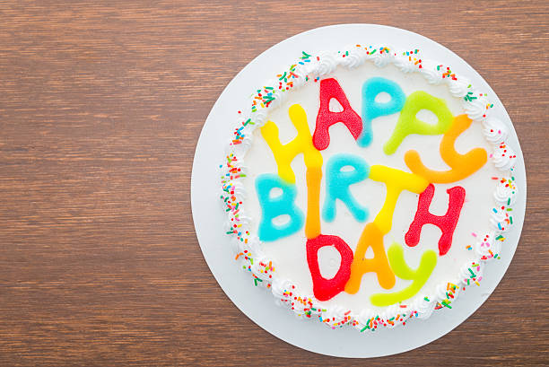 istock Happy birthday cake on wooden background 491045876