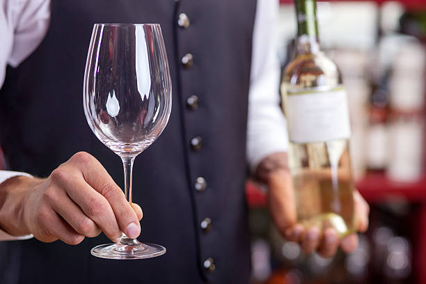 istock Skilled young male sommelier is working in bar 491046650