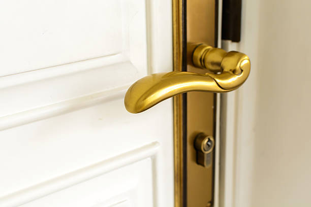 istock classic golden door handle on white door 491046964