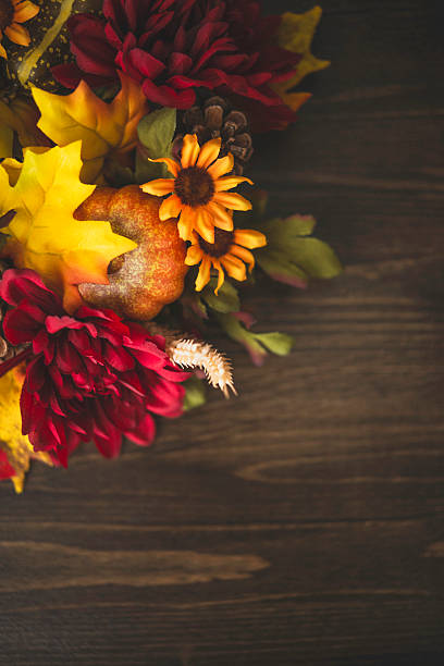 istock Fall themed decorations forming border on wooden background. Thanksgiving celebrations. 491047068
