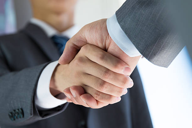 istock business people handshaking 491048570