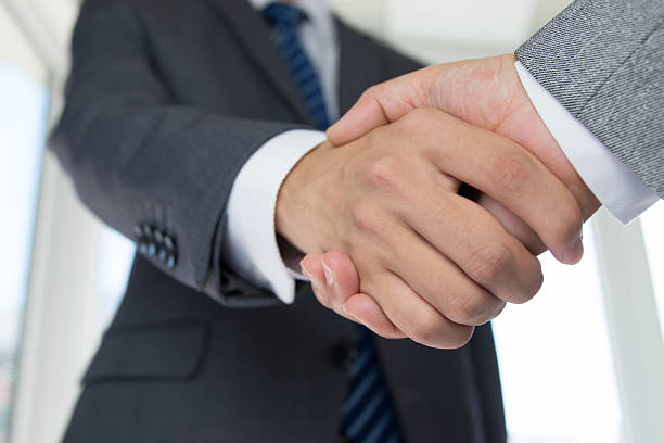 istock business people handshaking 491048844