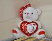 Teddy bear and big red heart with text