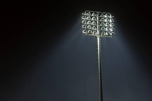istock Stadium lights against dark night sky background 491049948