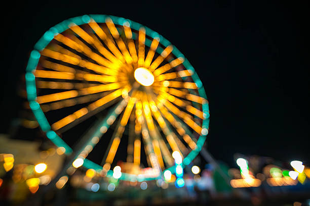 istock Blurry, Ferris wheel with outdoor long exposure at night. 491056220