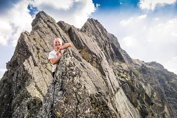 istock Middle aged man enjoying adventure in the mountains 491057712