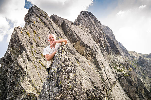 istock Middle aged man enjoying adventure in the mountains 491057966