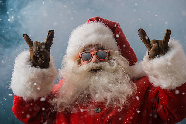 istock Santa Claus wearing sunglasses dancing outdoors at North Pole 491059242