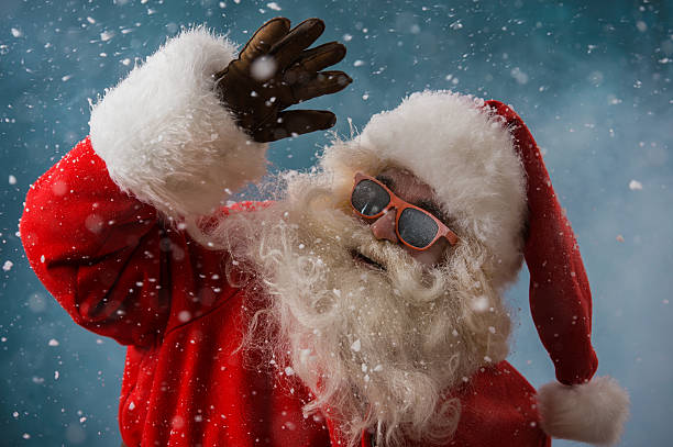 istock Santa Claus wearing sunglasses dancing outdoors at North Pole 491059332