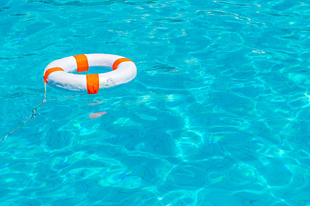 istock Life buoy in swimming pool 491059862